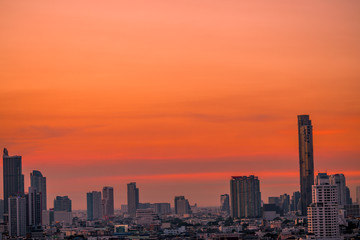 The abstract background of the evening sky and the surrounding buildings, showing the distribution of housing in the capital