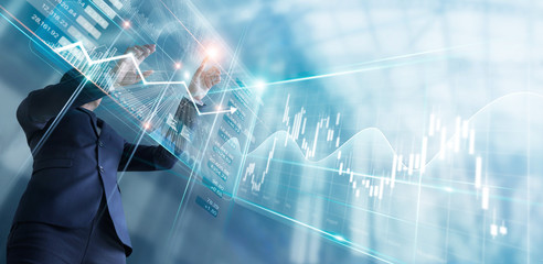 Businessman touching finance growth and graph chart analysing diagram sale data, stock market and currency exchange on virtual interface.