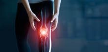 Woman Suffering From Pain In Knee, Injury From Workout And Osteoarthritis, Tendon Problems And Joint Inflammation On Dark Background.
