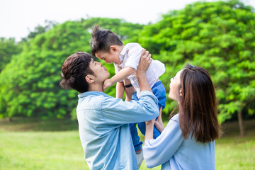 Canvas Print - parents play with kid outdoor