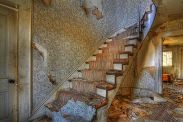 Sticker - Staircase covered in a carpet in an abandoned building with ruined walls