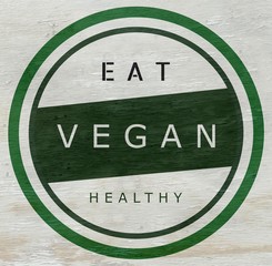Wall Mural - Eat vegan label on wood grain texture