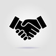 © Igor - Business handshake contract agreement flat vector with a soft shadow