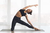 Relaxed girl streching arms and legs at home