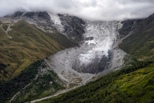 Aerial View To Adishi Icefall And Tongue With Small Waterfall On It Moraine And Kar In Mountains Of Svaneti Georgia