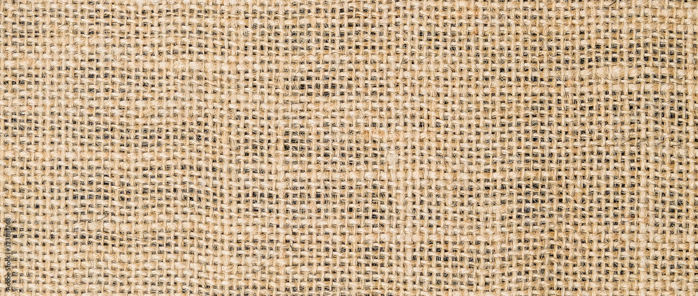 Hessian sackcloth burlap woven texture background/cotton woven fabric background with flecks of varying colors of beige and brown. with copy space. office desk concept. Hessian sackcloth burlap woven. - obrazy, fototapety, plakaty 
