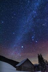 Wall Mural - a bright starry night in the mountains with the milky way in the sky, venus and millions of stars hi