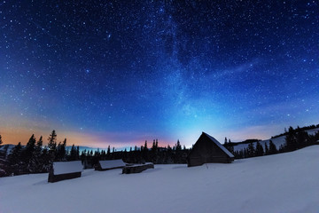 Wall Mural - a bright starry night in the mountains with the milky way in the sky, venus and millions of stars hi