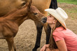 © MACO - Portrait of young cowgirl with horses. Bridger, Montana, USA