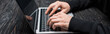 © LIGHTFIELD STUDIOS - panoramic shot of hacker typing on laptop keyboard