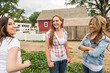 © MACO - Young cowgirls having fun on the ranch, smiling. Bridger, Montana, USA