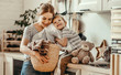© JenkoAtaman - Happy family mother housewife and child   in laundry with washing machine .