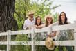 © MACO - Cowboy family all leaning on a fence. Bridger, Montana, USA