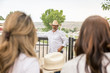 © MACO - Cowboy leaning on fence looking at his family. Bridger, Montana, USA