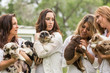 © MACO - Four women all holding puppies on a ranch. Bridger, Montana, USA