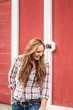 © MACO - Portrait of young western girl next to barn on a ranch. Bridger, Montana, USA