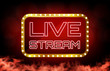 © moxumbic - abstract background of red neon live stream sign,online casino concept