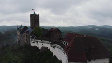 Aerial Shot Of The Wartburg Eisenach Germany UNESCO World Heritage Site On A Dark And Cloudy Day