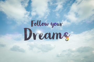 Follow your dreams word on cloudy blue sky background