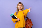 Fototapeta  - Teenager Russian student girl isolated on purple background presenting and inviting to come with hand
