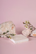 Pastel pink and white stone marble display set for product background decorate with white flower