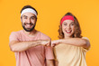 © Drobot Dean - Portrait of athletic couple smiling and bumping their fists together