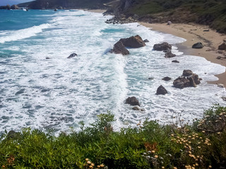 Rocky Beach of Potistika in Greece on a clear summer day