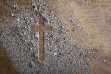 Christian Cross Symbol Made Of Ash On A Wooden Background