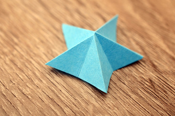 Wall Mural - A folded blue paper star