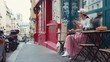 Attractive girl having breakfast in a street cafe in Paris