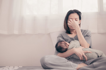 tired mother suffering from experiencing postnatal depression.health care single mom motherhood stre