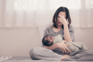 tired mother suffering from experiencing postnatal depression.health care single mom motherhood stre