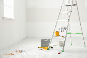 Poster - Stepladder and different tools in room, space for text. Interior renovation