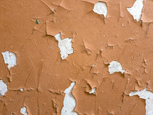 Closeup Image Of Brown Paint Peeling From White Wall