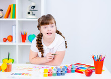 Girl With Down Syndrome Draws At Home