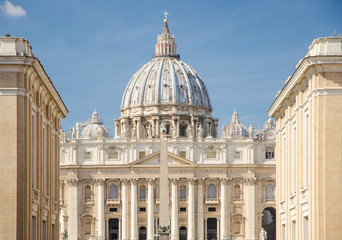 Piazza San Pietro in a sunny day, perspective from the street of conciliation In the foreground the Egyptian obelisk and to follow the facade of the basilica and the dome of St. Peter