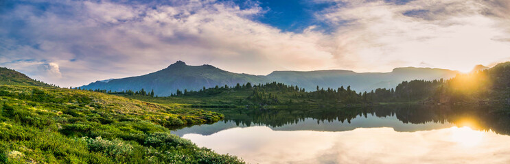 panoramic landscape, majestic sunset view at blue mountain lake at khamar-daban mountain range in wi