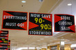 © ALAN - Signs for a store wide 90% off bankruptcy sale hanging from the ceiling of a store
