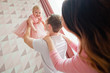 © Elena  - happy family with a daughter in a pink dress