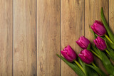 Fototapeta Tulipany - Tulips on a wooden background