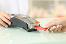 Client Paying With Credit Card Reader In A Pharmacy