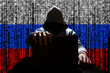 Russian hacker closes the lid of the laptop, against the backdrop of a binary code, the color of the Russian tricolor