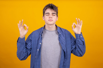 Wall Mural - young teenager or student boy isolated on color background