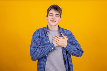 Poster - young teenager or student boy isolated on color background