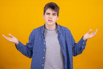 Wall Mural - young teenager or student boy isolated on color background