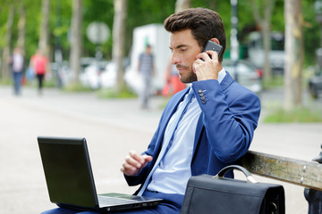 portrait of a handsome businessman on the phone