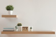 © New Africa - Wooden shelves with beautiful plants and calendar on light wall