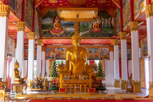 Wat Si Saket, A Large Golden Buddha Statue And Altar With Offerings And Wall Murals, Vientiane, Laos,Vientiane