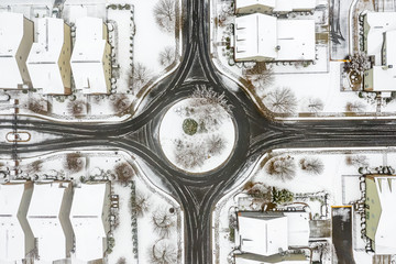 aerial top to bottom view Atlanta Georgia suburbs roundabout just after snow fall