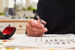 © tommoh29 - Mature man doing a crossword puzzle and relaxing at home during the day, indoor shot